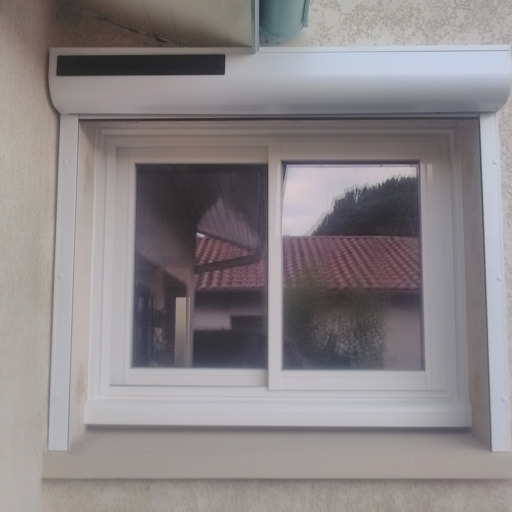 Pose de volets coulissants après